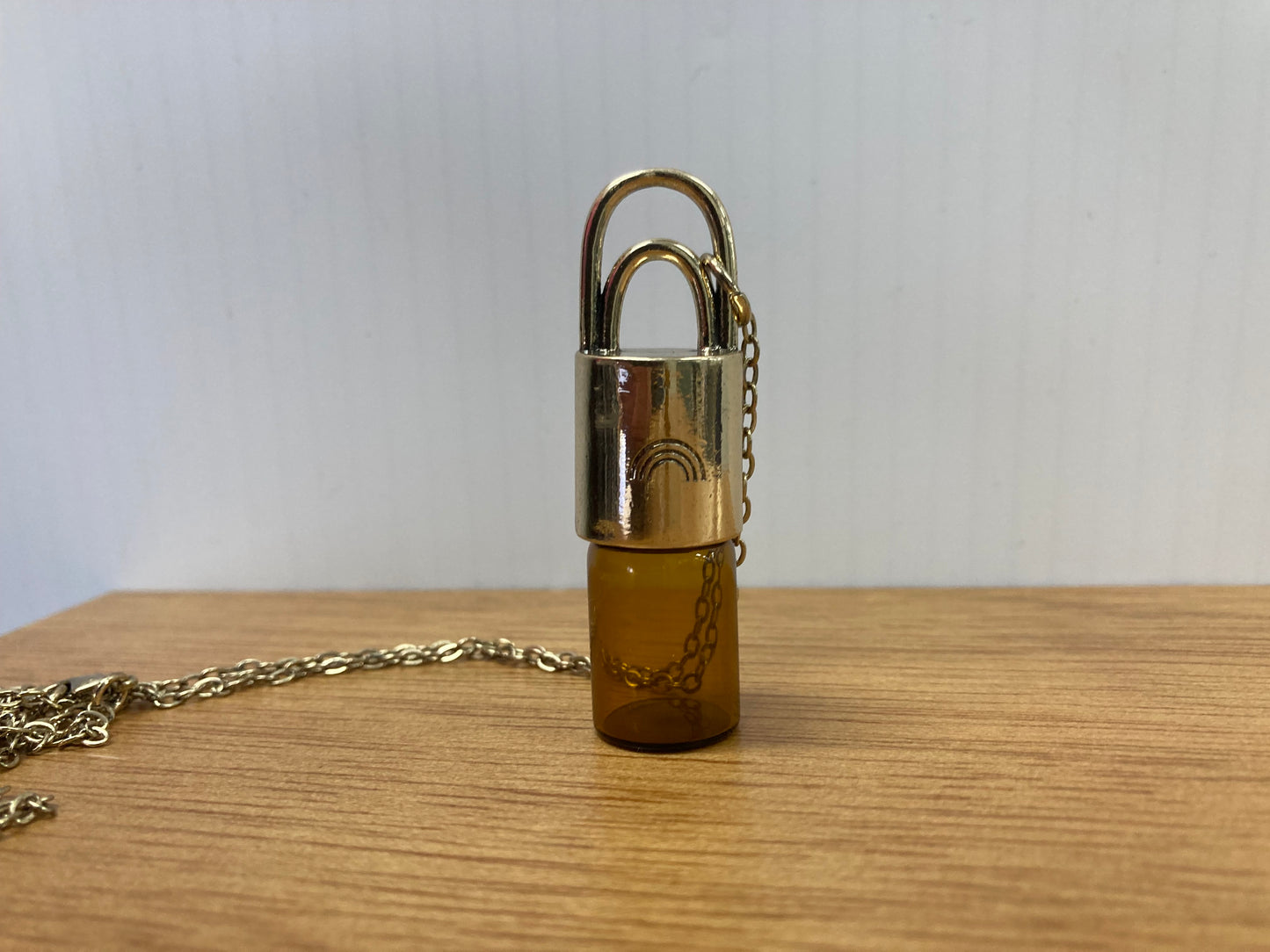 Perfume bottle necklace